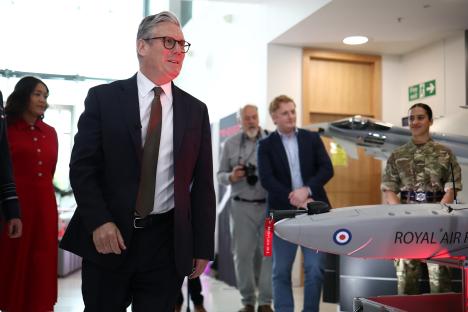 Prime Minister Keir Starmer at a defense contractor's facility, launching a Royal Air Force drone.