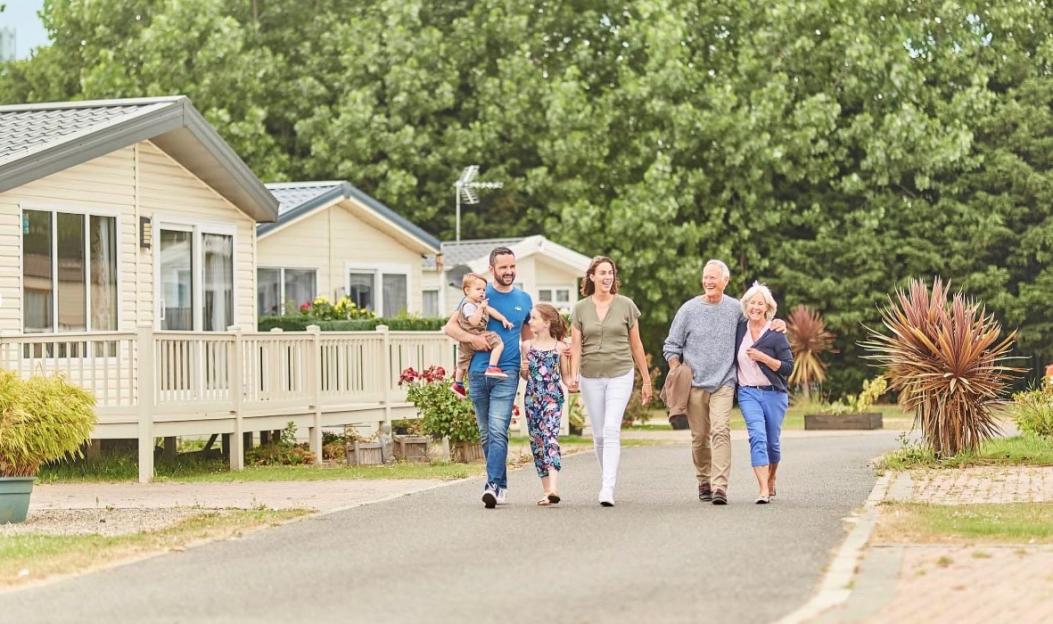 Family walking together in Highfield Grange Holiday Park.