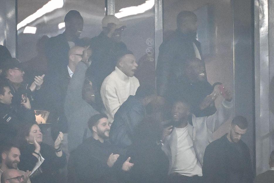 Kylian Mbappé and Wilfrid Mbappé celebrating a goal during the match between Lille OSC and Paris Saint-Germain.