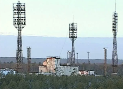 Launch complex with tall lighting towers.
