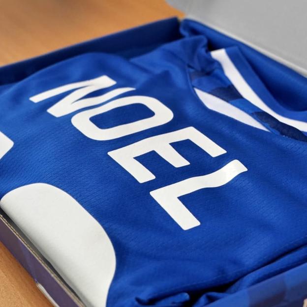 A blue football jersey with "NOEL" written on the back.