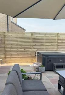 Garden with new privacy fence, hot tub, and patio furniture.
