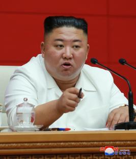 Kim Jong-Un speaking at a meeting.