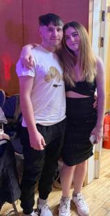 Young couple posing for a photo.