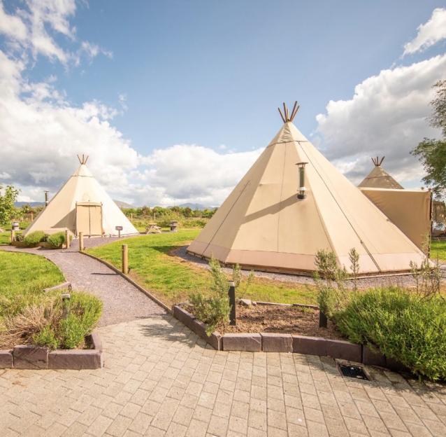 Two teepees at Greenwood Family Park in Wales.