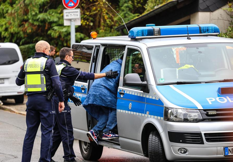 Heartbreaking Photo Emerges of Son Questioned by Police After His Mayor Mother is Stabbed and Battles for Her Life in Hospital