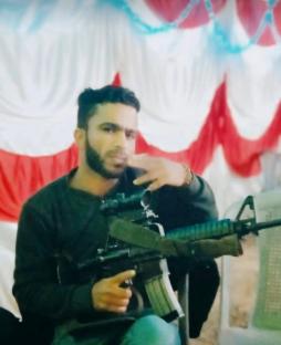 Man holding assault rifle.