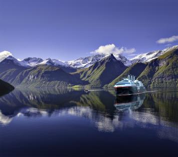 Illustration of the Sea Zero, a zero-emission cruise ship with retractable solar sails.