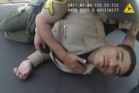 Watch shocking moment policeman collapses after accidentally inhaling lethal drug – as horrified colleagues rush to help