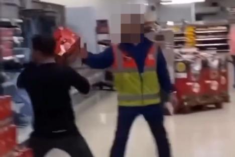 Moment rampaging Tesco shopper lobs crates of beer at security guard’s FACE… before being tackled by hero onlooker