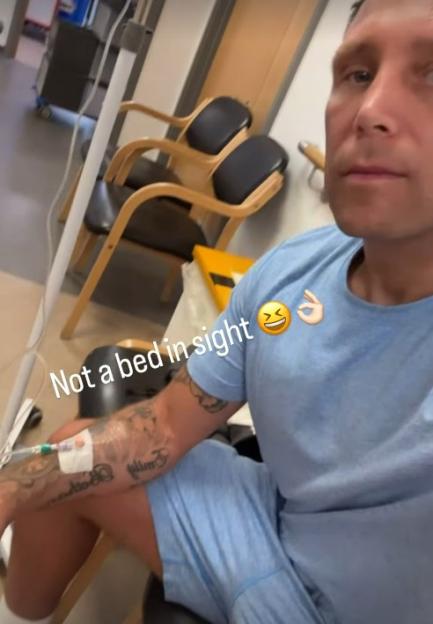 Gerwyn Price in a hospital waiting room with an IV drip, captioned "Not a bed in sight."