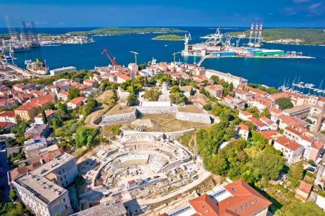 Aerial view of Pula, Istria, showing a defense fortress and the bay.