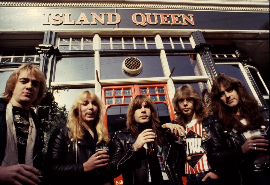 The English heavy metal group Iron Maiden outside the Island Queen pub in Islington, London.