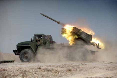 Iranian troops firing a missile during a military exercise.