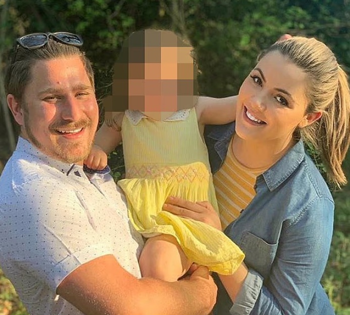 Family photo with a child's face blurred.