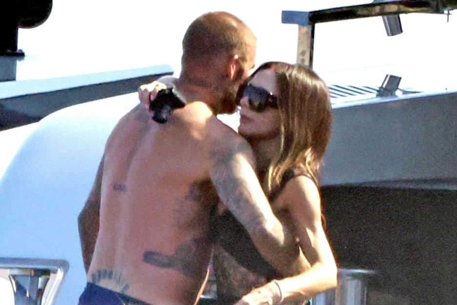 Topless David Beckham grabs Victoria’s bum on £16m superyacht holiday with sons Cruz and Romeo