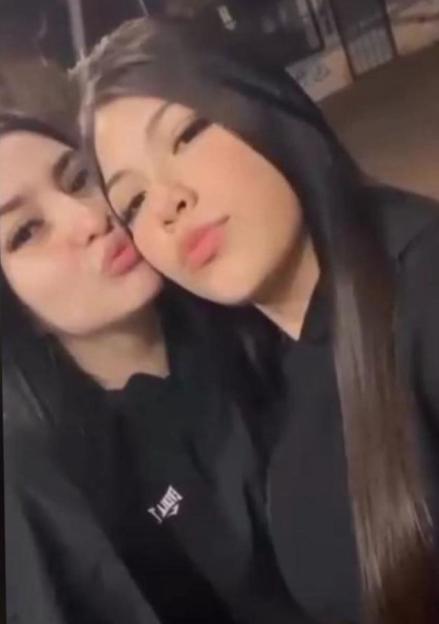 Lara Gutierrez and Brenda del Castillo posing together in black hoodies.