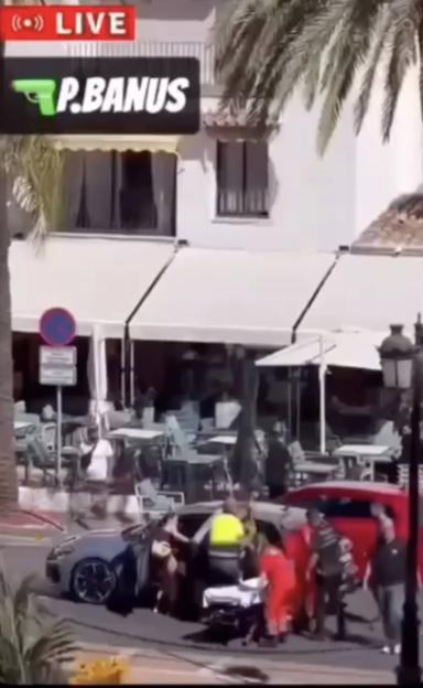 Emergency personnel attend to a shooting victim in Puerto Banus.