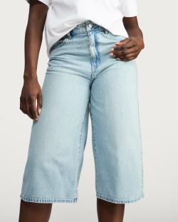 Light blue denim Bermuda shorts.