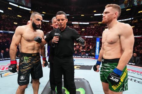 Belal Muhammad and Jack Della Maddalena facing off before a UFC welterweight championship bout.