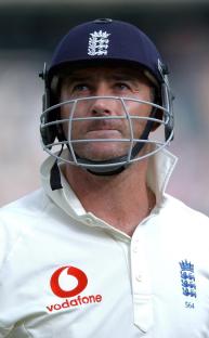 Photo of Graham Thorpe in cricket whites and helmet.