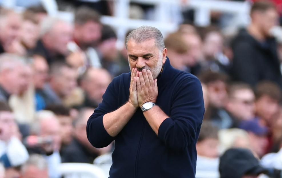 Ange Postecoglou, head coach of Nottingham Forest, standing with hands covering his mouth during a match.