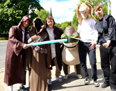 Group of people in Star Wars costumes.