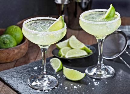 Pineapple jalapeño margaritas in martini glasses.