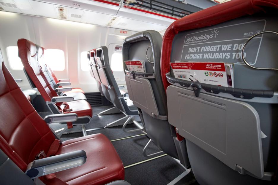Empty Jet2 airplane passenger seats.