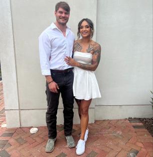 Newlyweds posing for a photo.