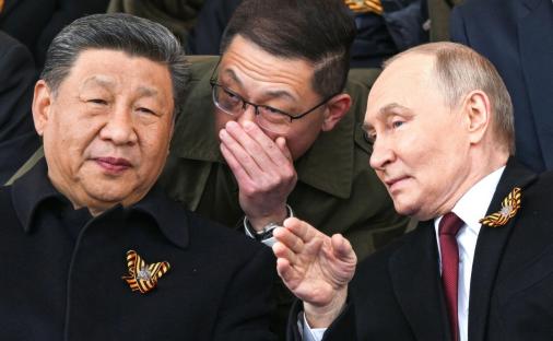 Vladimir Putin and Xi Jinping at a military parade.