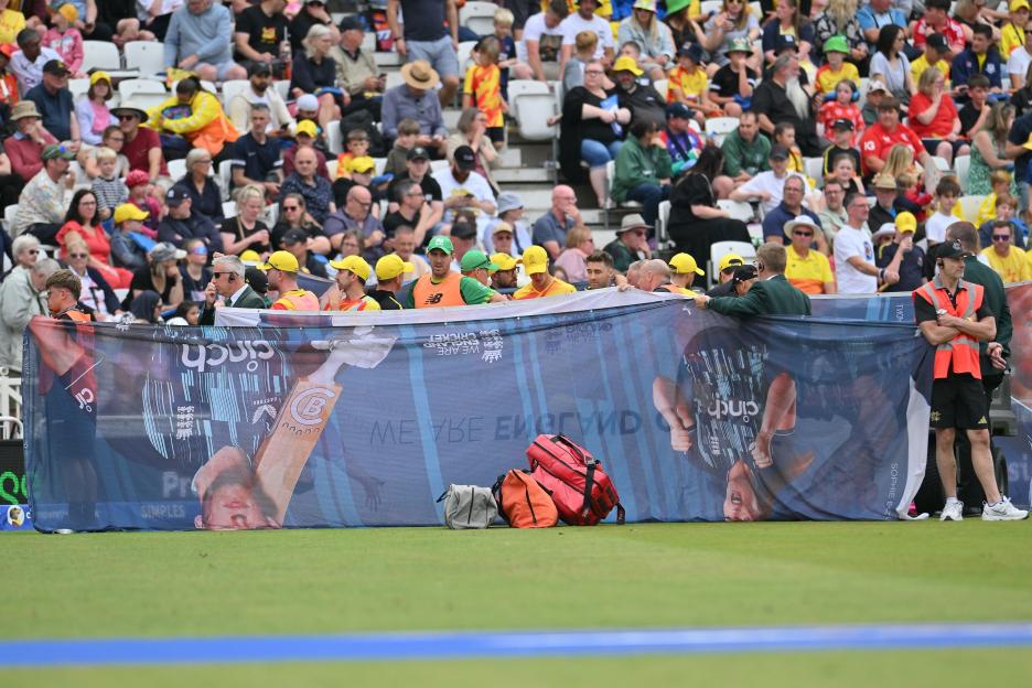Trent Rockets player receiving treatment behind a screen during a cricket match.