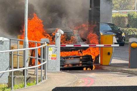 Moment car bursts into flames at Gatwick Airport as thick smoke pours from bonnet in front of screaming onlookers