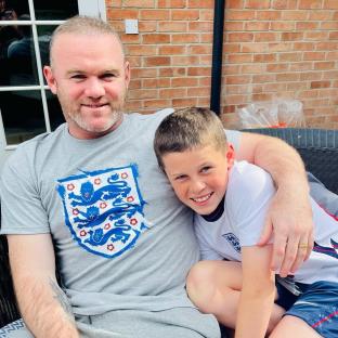 Wayne Rooney and his son Kai celebrating an England win.