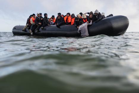 Migrants in a small boat attempting to cross the English Channel.