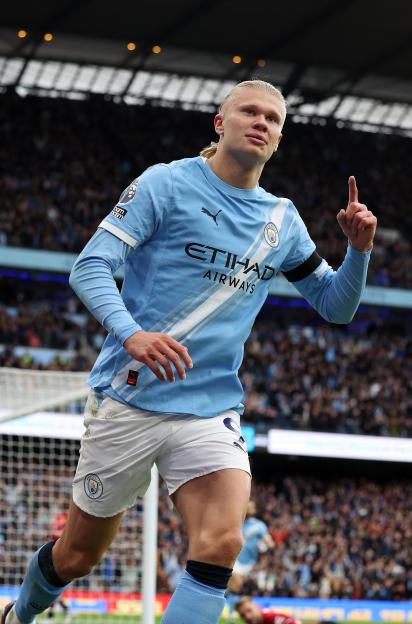Erling Haaland celebrating scoring a goal.