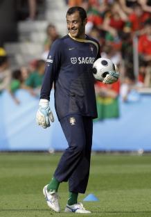 Nuno Espirito Santo, Portuguese goalkeeper, smiles while holding a soccer ball.