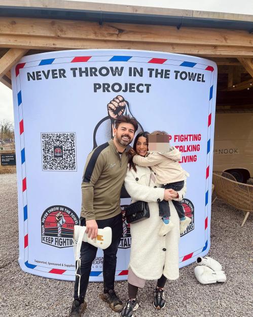 Anthony Hutton with his family at the Never Throw in the Towel Project.