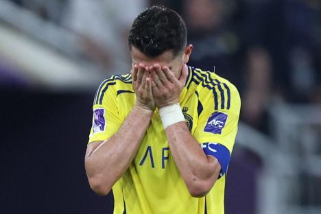 Cristiano Ronaldo reacting during a soccer game.