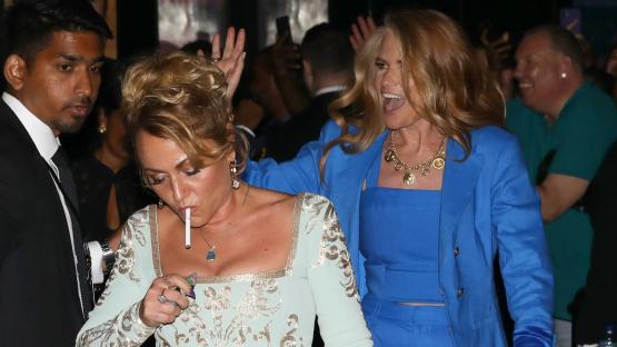 Blearly-eyed EastEnders and Corrie stars scoff burgers and puff on cigarettes as they leave boozy British Soap Awards