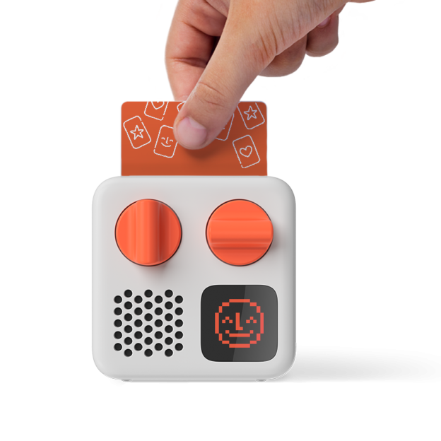 Hand inserting card into yotomini device.