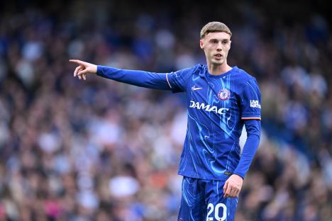 Cole Palmer of Chelsea points during a Premier League match.