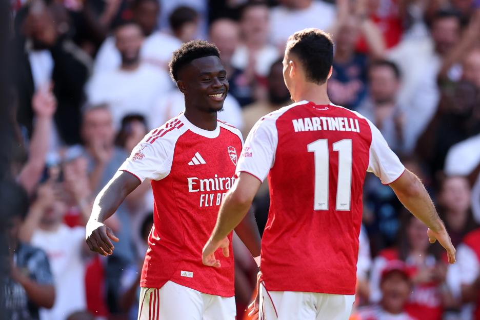 Bukayo Saka and Gabriel Martinelli celebrating a goal.