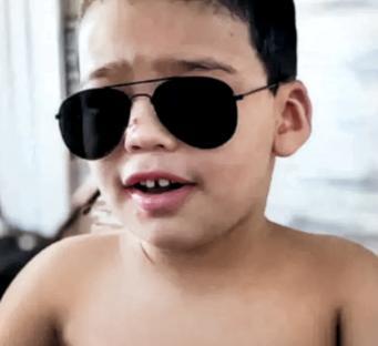Photo of Italo Alves dos Santos, 4, wearing aviator sunglasses.