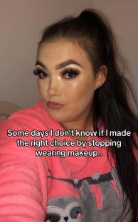 Woman with makeup in pink pajamas.