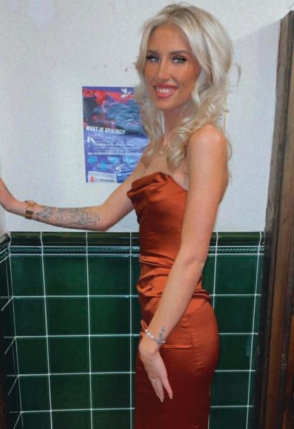 Woman in burnt orange dress.