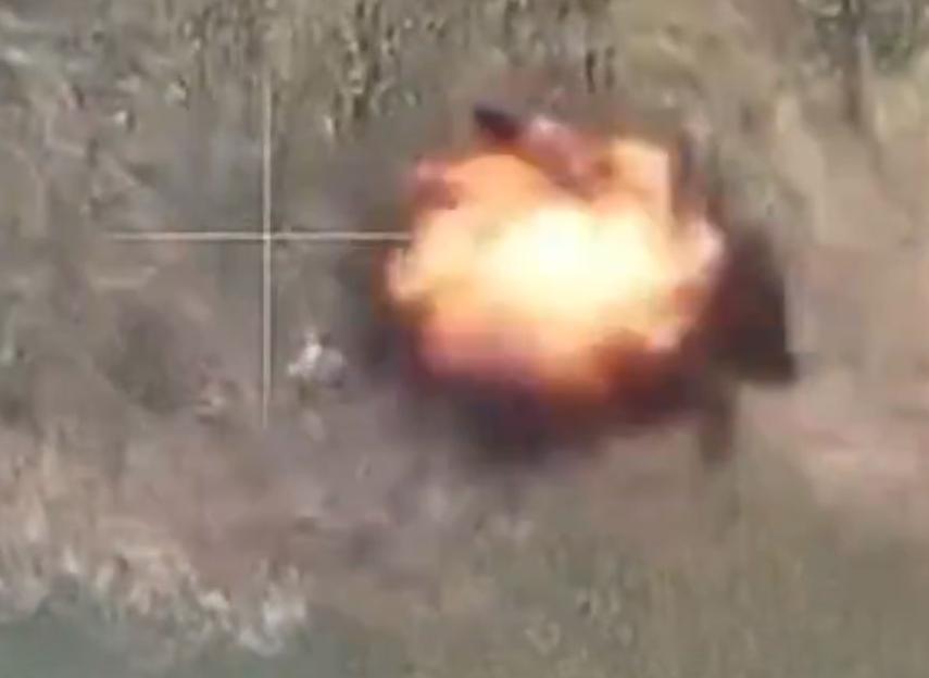 An explosion with a targeting reticle over it.