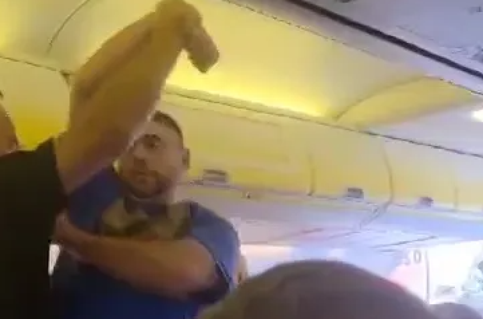 THIS is the dramatic moment armed cops dragged boozed-up Brit stag do louts off a Ryanair jet – after they allegedly kicked off mid-flight
