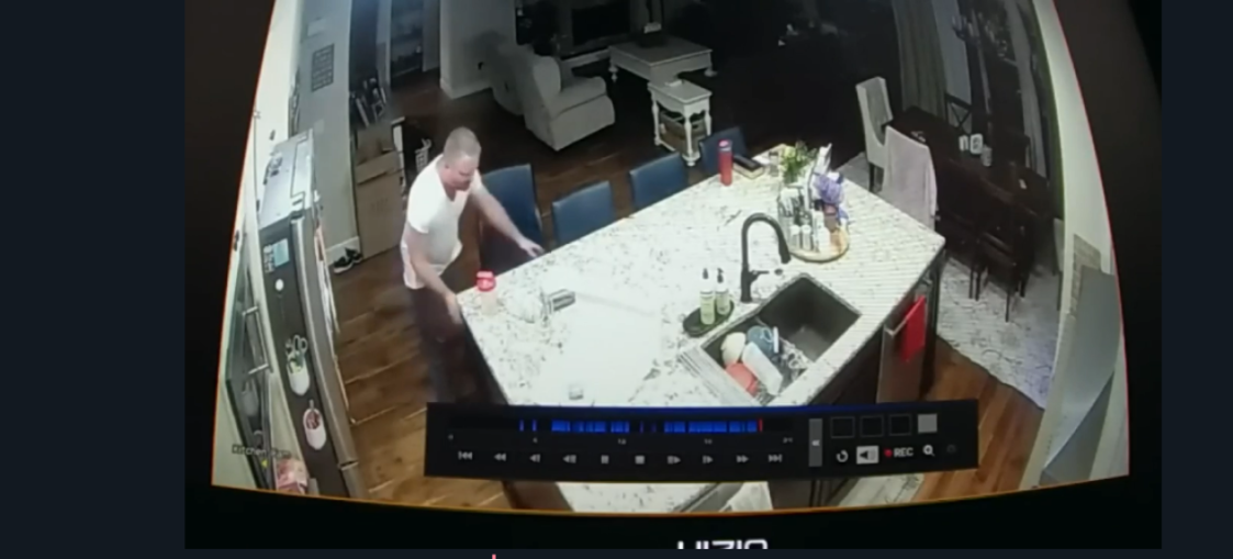 Surveillance footage of James Craig in a kitchen.