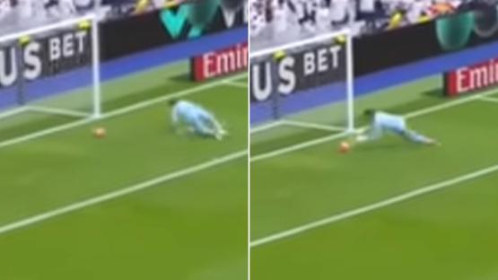 Soccer goalie diving to save a goal.